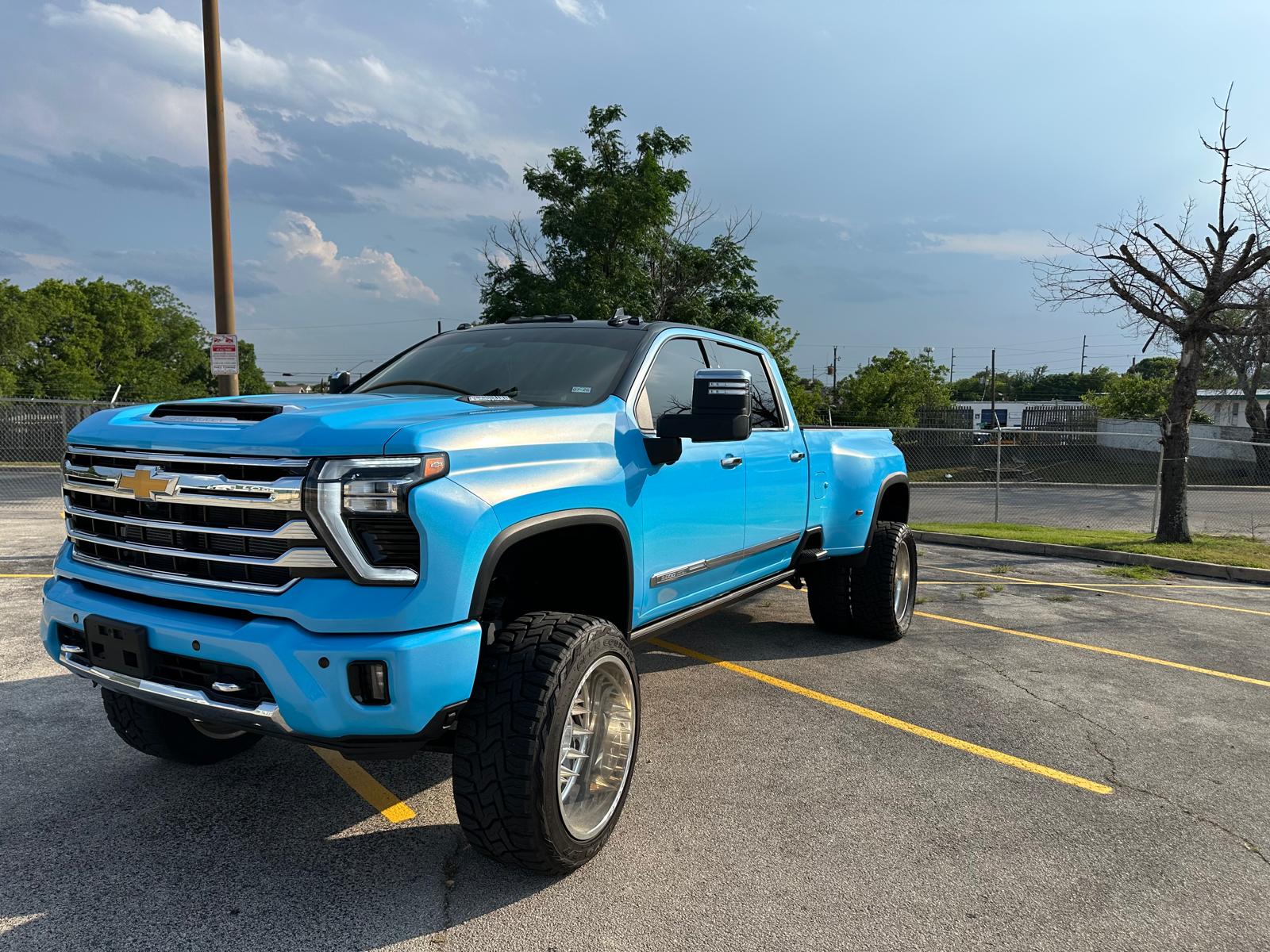 Electric blue lifted truck completed by Phantom