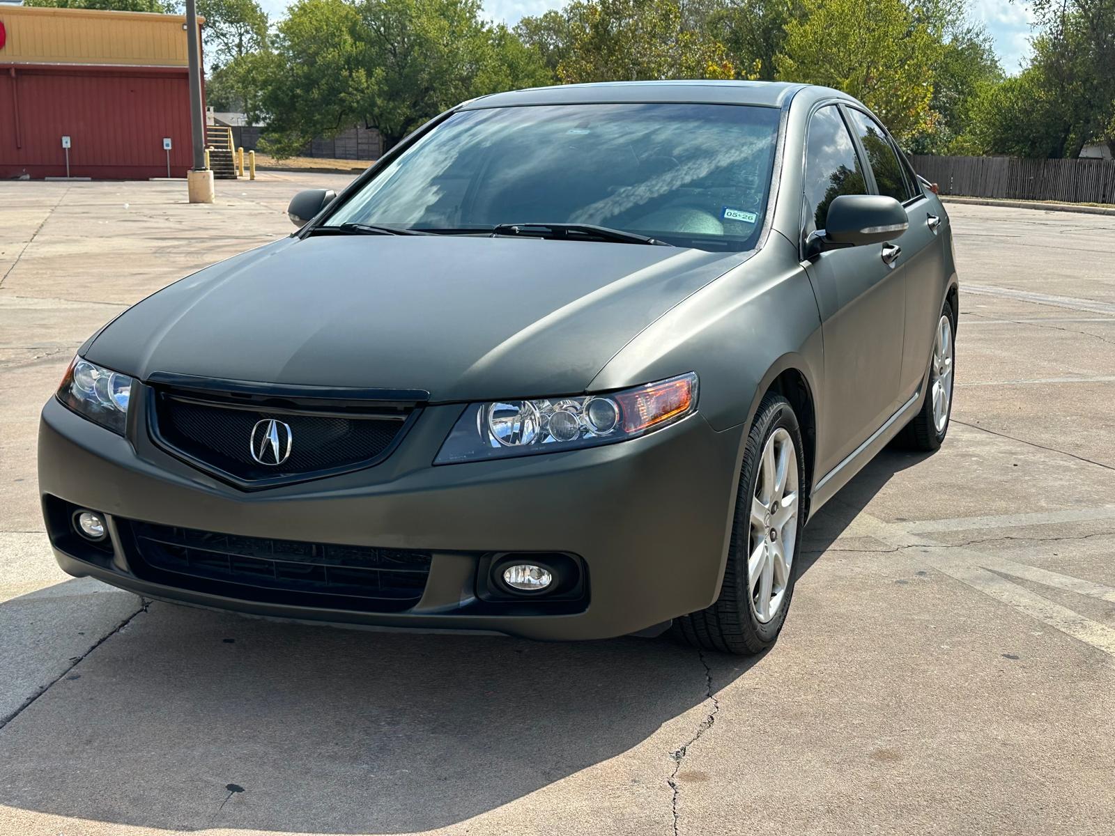 Satin charcoal sedan completed by Phantom
